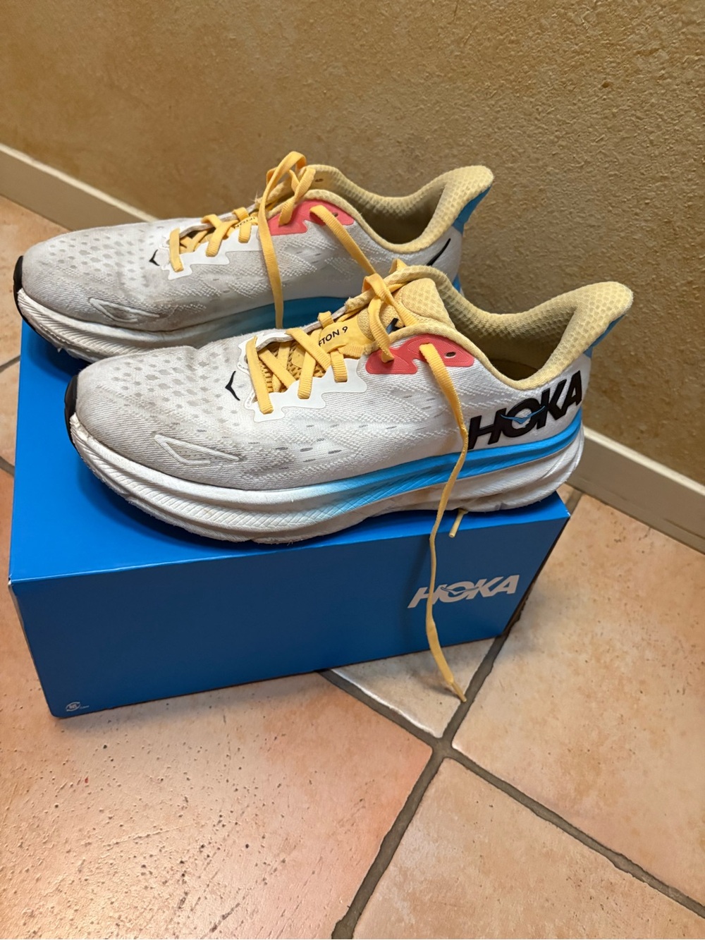 Hoka One One Women's White Running Shoes with Blue & Yellow Accents - Picture 2 of 5